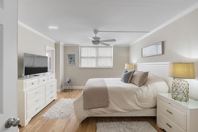 bedroom with ceiling fan, light wood-style flooring, baseboards, and ornamental molding