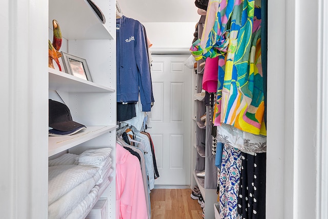 spacious closet featuring light wood-type flooring