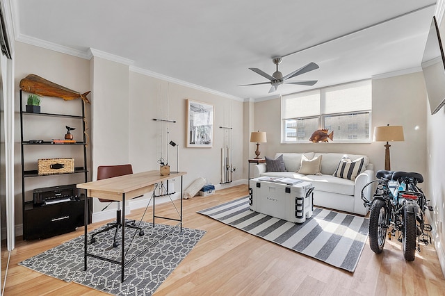 home office featuring ornamental molding, hardwood / wood-style flooring, and ceiling fan