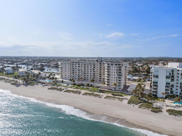 drone / aerial view featuring a view of the beach and a water view