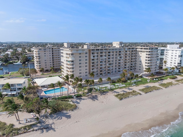 bird's eye view featuring a view of the beach and a water view