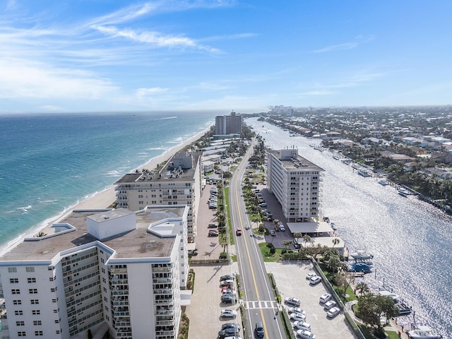 bird's eye view featuring a beach view, a water view, and a view of city