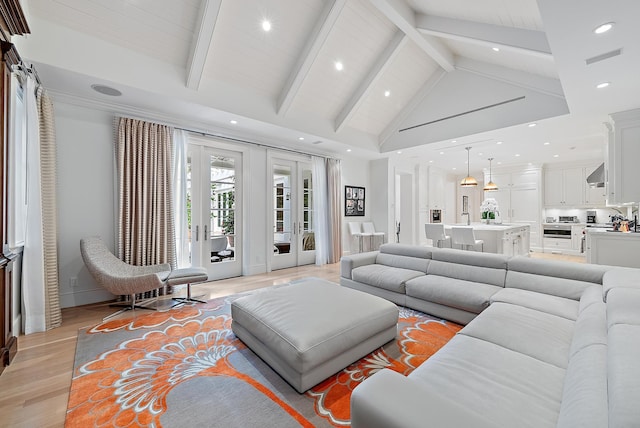 218 Seabreeze Ave, Palm Beach, FL 33480 - living area with light wood-style floors, beam ceiling, recessed lighting, high vaulted ceiling, and french doors