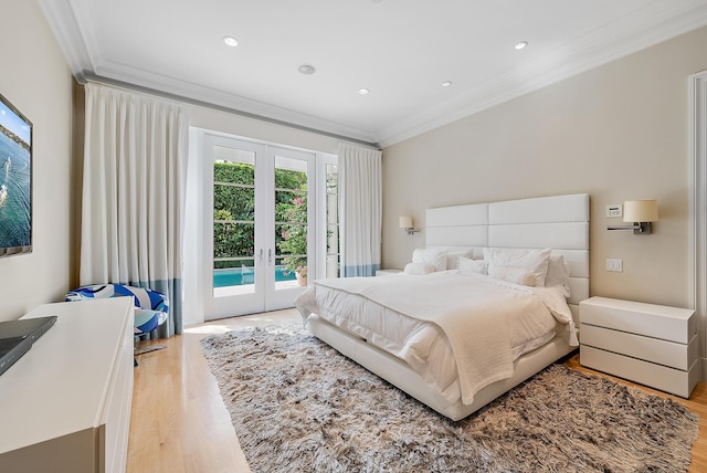 bedroom with french doors, crown molding, wood-type flooring, and access to exterior