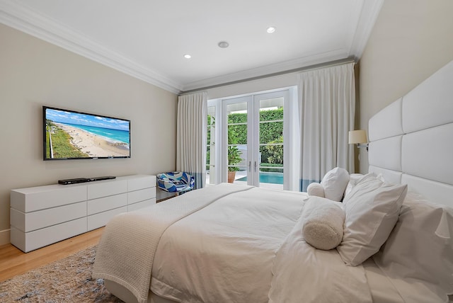 bedroom featuring french doors, light hardwood / wood-style floors, access to outside, and ornamental molding