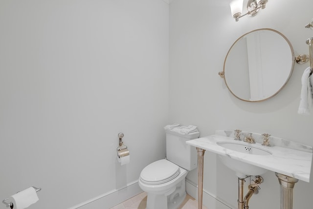 bathroom featuring tile patterned floors and toilet