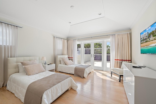 bedroom featuring lofted ceiling, french doors, access to outside, light hardwood / wood-style flooring, and ornamental molding