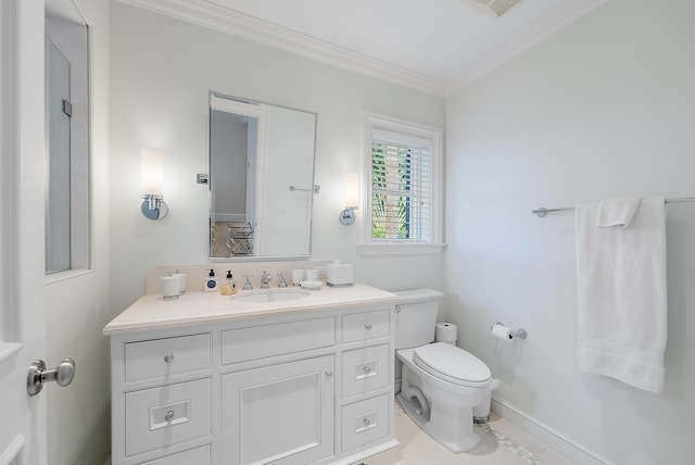 bathroom featuring vanity, ornamental molding, toilet, and tile patterned flooring