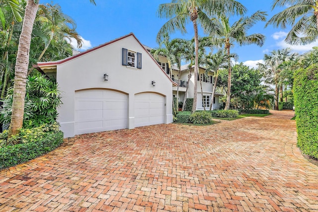 218 Seabreeze Ave, Palm Beach, FL 33480 - mediterranean / spanish-style house featuring decorative driveway and stucco siding