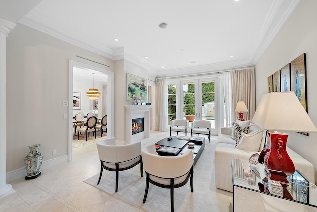 living room featuring ornate columns and ornamental molding