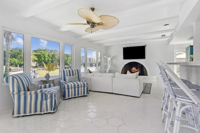 living room featuring beam ceiling and ceiling fan