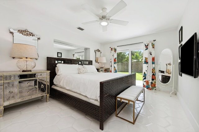 bedroom with access to outside, light tile patterned floors, and ceiling fan