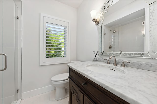 bathroom featuring vanity, a shower with shower door, toilet, and tile patterned floors