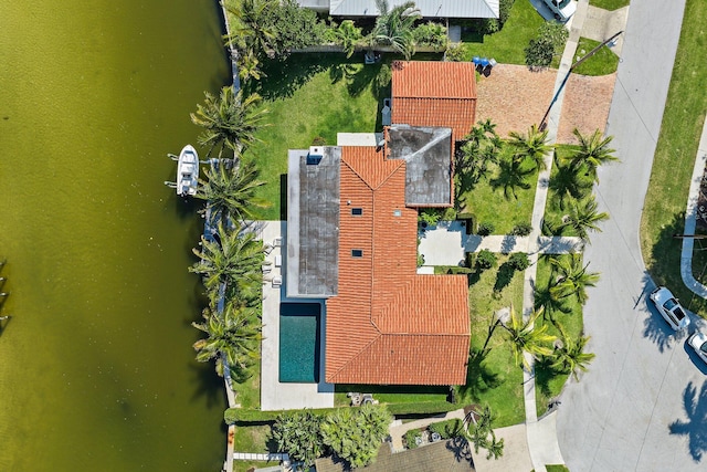 birds eye view of property featuring a water view