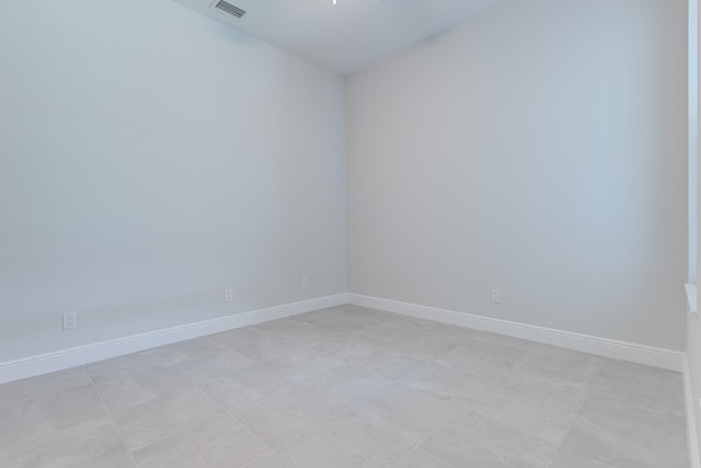 spare room with light tile patterned floors