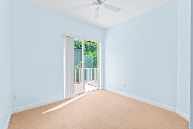 empty room with ceiling fan and carpet floors