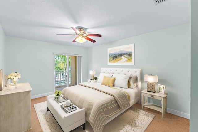 carpeted bedroom featuring ceiling fan, a textured ceiling, and access to outside