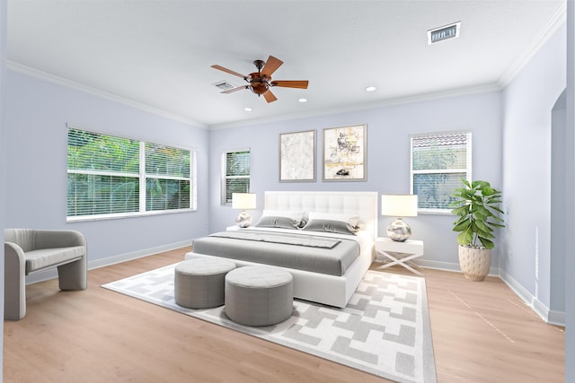 bedroom featuring light wood-type flooring, ceiling fan, and ornamental molding