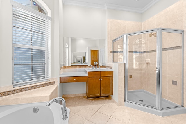 bathroom with tile patterned floors, vanity, crown molding, and independent shower and bath