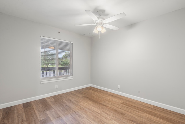 unfurnished room featuring ceiling fan and wood-type flooring