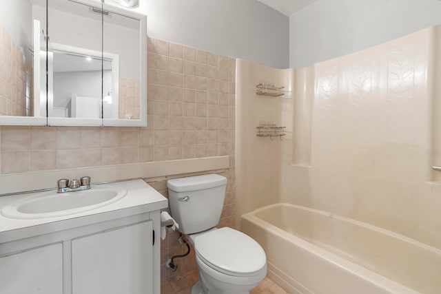 full bathroom with decorative backsplash, toilet, tile walls, vanity, and bathing tub / shower combination