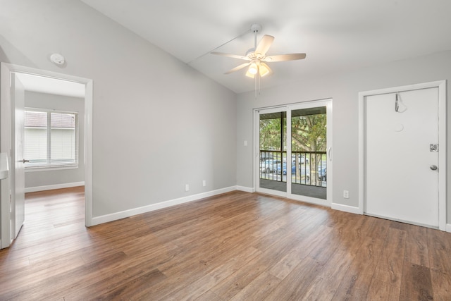 interior space with lofted ceiling, wood-type flooring, and ceiling fan