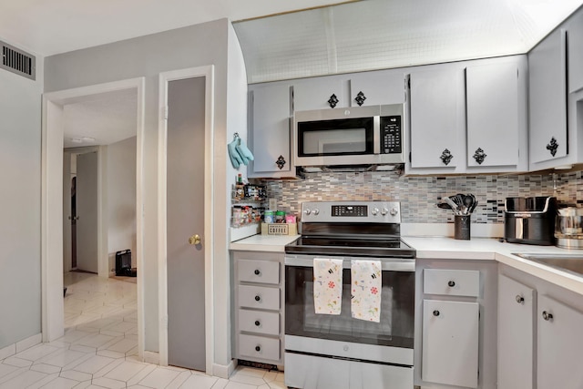 kitchen featuring decorative backsplash and stainless steel appliances