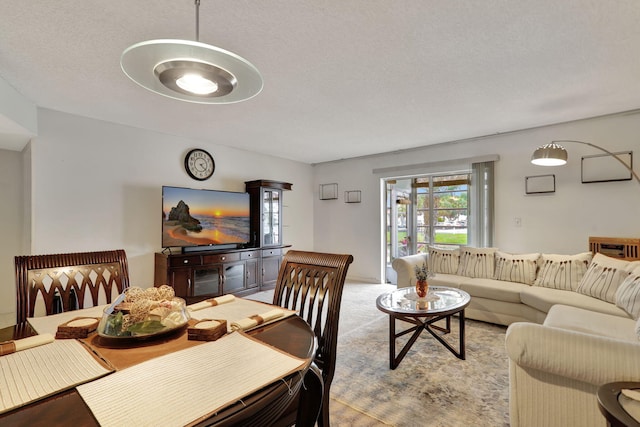 dining area with a textured ceiling