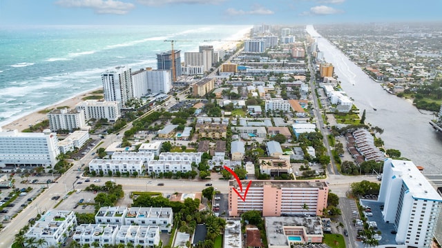 bird's eye view with a view of the beach and a water view