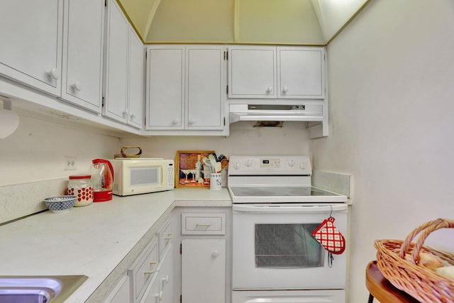 kitchen with white cabinets, white appliances, and lofted ceiling