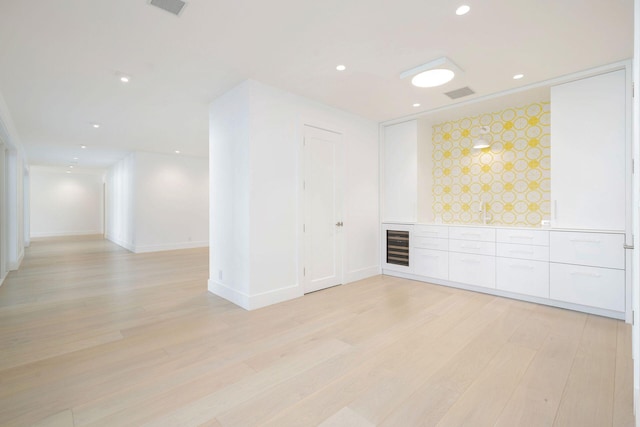 empty room with light hardwood / wood-style floors