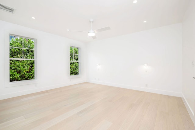 unfurnished room featuring ceiling fan and light hardwood / wood-style flooring