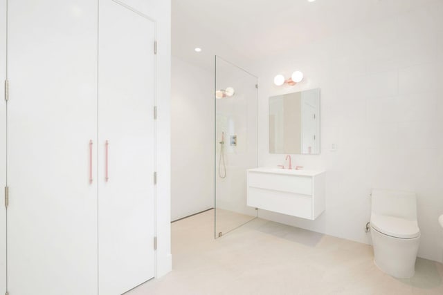 bathroom with toilet, a shower, and vanity