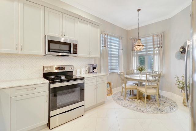 kitchen with light stone countertops, decorative light fixtures, crown molding, and stainless steel appliances