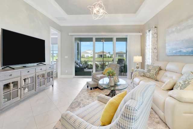 tiled living room with an inviting chandelier and a raised ceiling