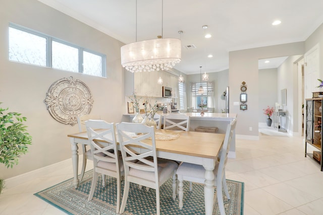 tiled dining room with crown molding