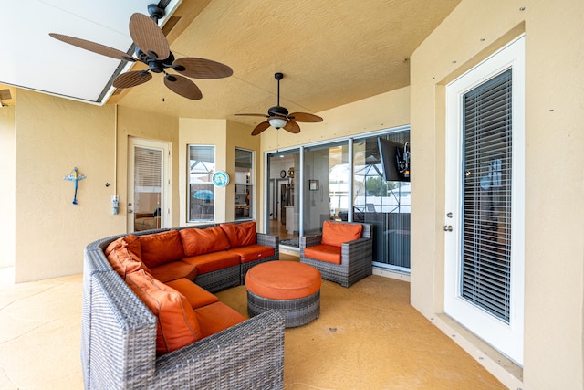 view of patio featuring an outdoor living space and ceiling fan