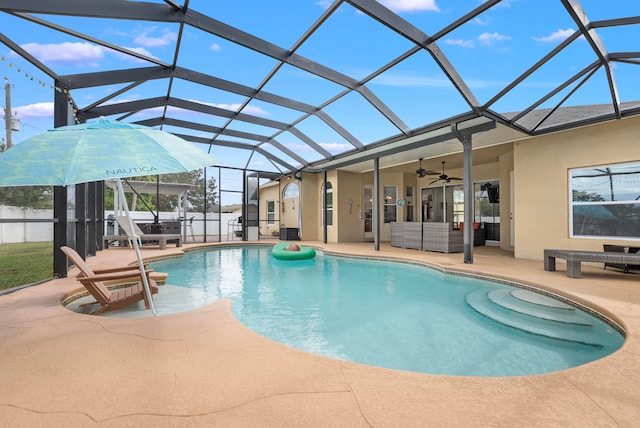 view of pool featuring a patio area, a lanai, and ceiling fan