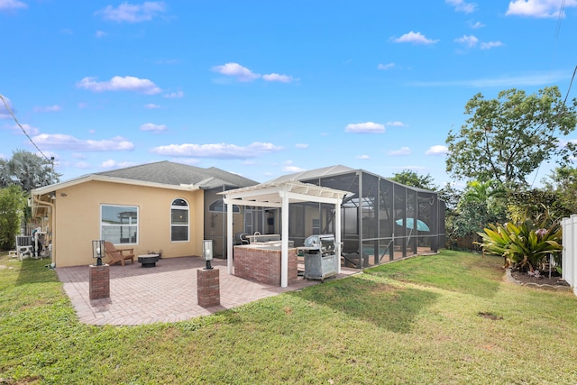 rear view of house featuring a yard, a patio, and a lanai