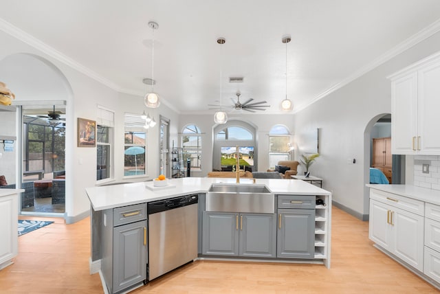 kitchen featuring gray cabinets, white cabinets, tasteful backsplash, and stainless steel dishwasher