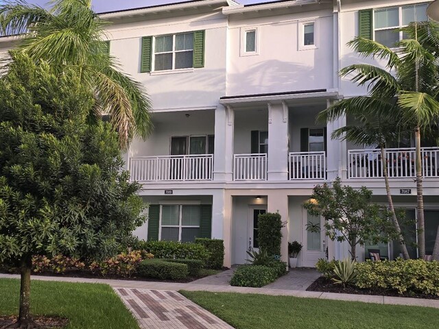 entrance to property featuring a balcony