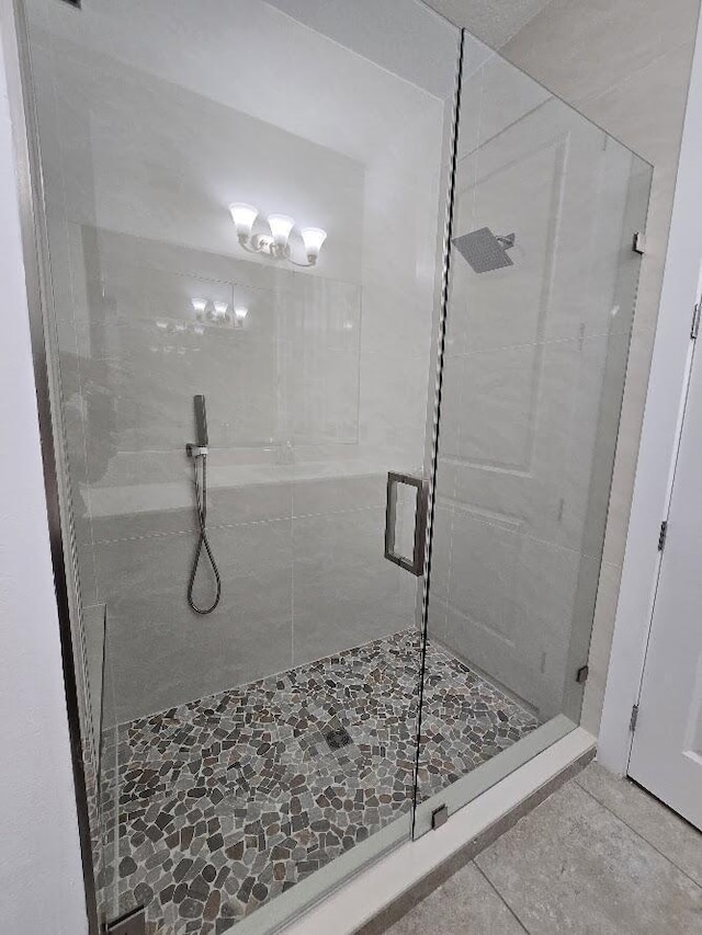 full bath featuring a stall shower and tile patterned floors