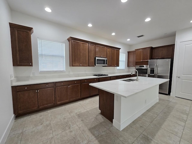 kitchen featuring visible vents, appliances with stainless steel finishes, a sink, and recessed lighting