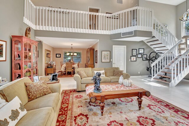 kitchen featuring sink, stainless steel appliances, light stone counters, backsplash, and light tile patterned floors