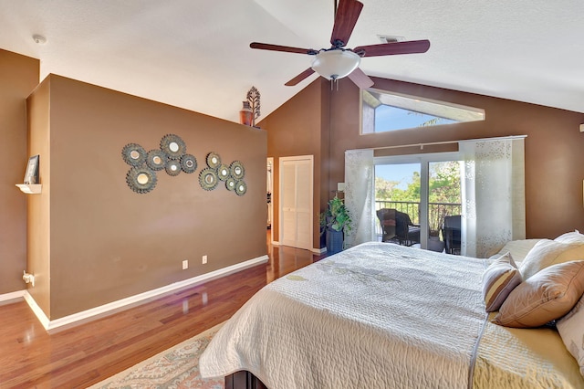 bedroom featuring ceiling fan, wood-type flooring, access to outside, and vaulted ceiling