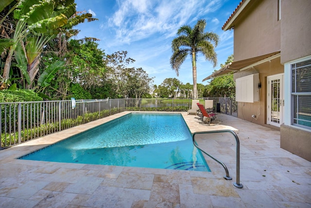 view of swimming pool with a patio