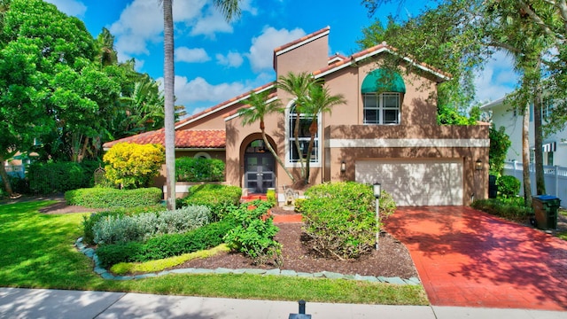 mediterranean / spanish-style house featuring a garage