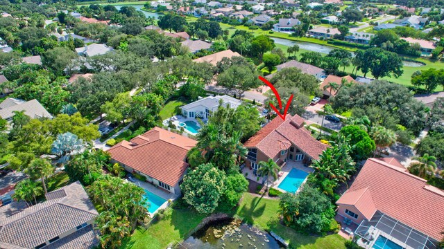 birds eye view of property with a water view