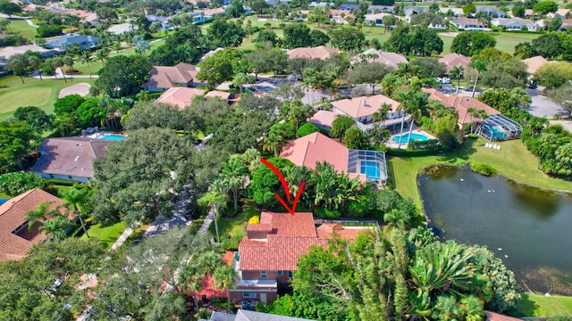 birds eye view of property with a water view