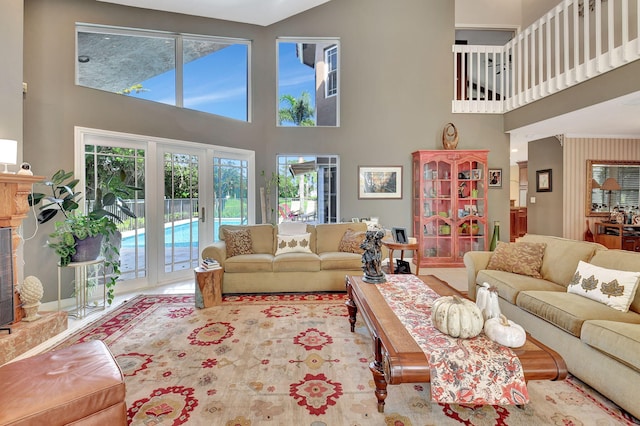 living room featuring french doors and a towering ceiling